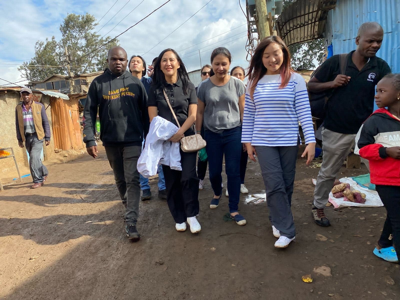 Walk Kibera with residents.